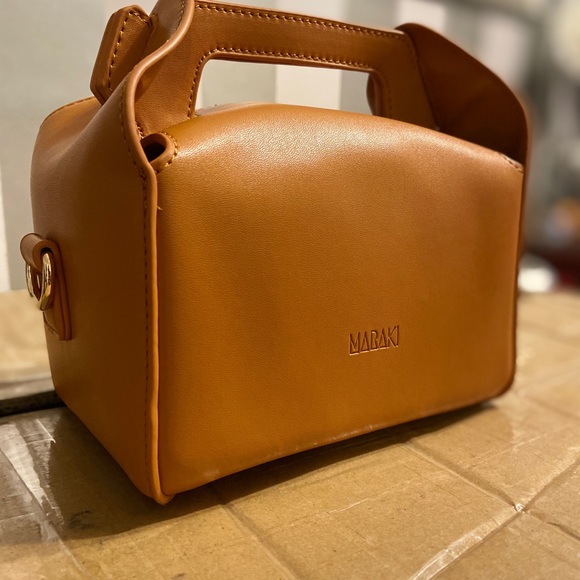 Two different styles of bags tan togo bag and black onyx cube bag - Picture 5 of 7